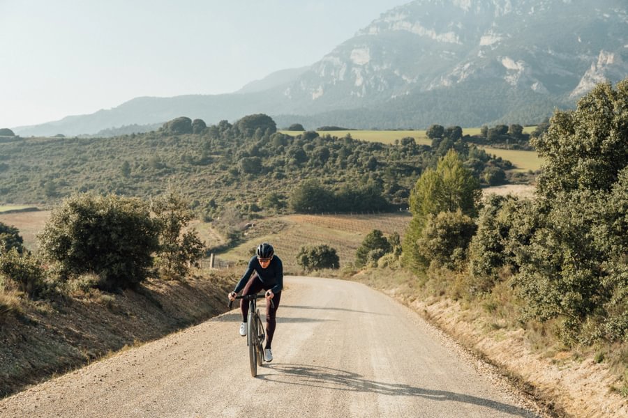 Cyclist dancing on a route gravel