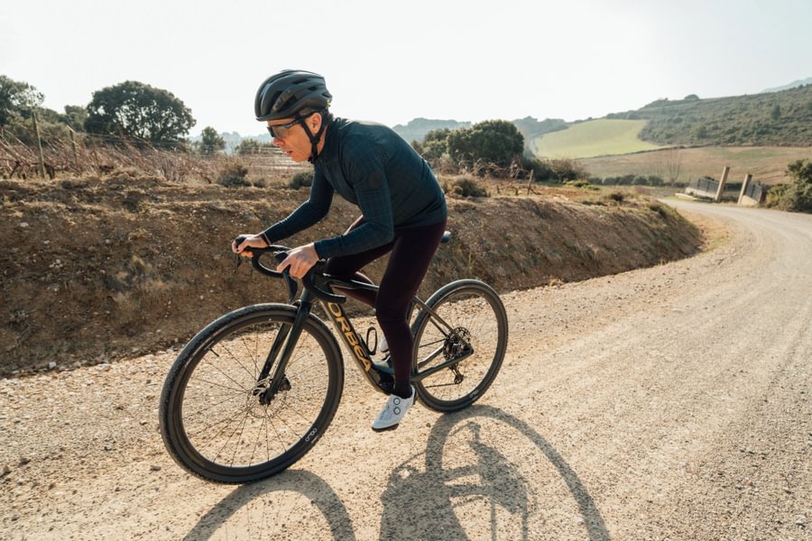 Cyclist in full effort on a route gravel
